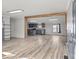 Open-concept living room featuring wood floors, modern lighting, and a view of the kitchen at 2154 Withers Dr, Maiden, NC 28650
