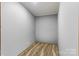 A clean, spare, simple storage or bonus room with wood-look vinyl floors and light gray walls at 2154 Withers Dr, Maiden, NC 28650