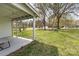View from the covered patio highlighting the expansive, grassy backyard space at 217 Cedarhurst Ln, Clover, SC 29710