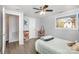 Bright bedroom features a ceiling fan, wood flooring, and a window with a view at 217 Cedarhurst Ln, Clover, SC 29710