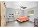 This spacious bedroom features a ceiling fan, wood look flooring, and a double barn door closet at 217 Cedarhurst Ln, Clover, SC 29710