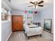 Cozy bedroom with a wooden armoire, decor, and a window offering natural light at 217 Cedarhurst Ln, Clover, SC 29710