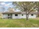 Rear exterior of the home featuring a covered patio and spacious backyard at 217 Cedarhurst Ln, Clover, SC 29710