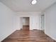 Bright, spacious room showcasing laminate flooring, fresh paint, and neutral colors at 2300 Kennesaw Dr, Charlotte, NC 28216