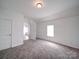 Bright room showcasing fresh paint, neutral colors, and carpeted floors at 2300 Kennesaw Dr, Charlotte, NC 28216