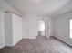 Bright room showcasing fresh paint, neutral colors, and carpeted floors at 2300 Kennesaw Dr, Charlotte, NC 28216