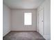 Bedroom featuring neutral carpet, a window, and a closet with a white door at 2300 Kennesaw Dr, Charlotte, NC 28216