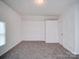 Bright room showcasing fresh paint, neutral colors, and carpeted floors at 2300 Kennesaw Dr, Charlotte, NC 28216