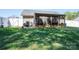 Spacious backyard featuring a screened-in porch perfect for outdoor relaxation and entertaining at 2401 Gelsinger Ave, Bessemer City, NC 28016