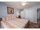 Comfortable bedroom with closet space, neutral walls, and a ceiling fan at 2401 Gelsinger Ave, Bessemer City, NC 28016