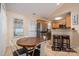 Bright dining area featuring a rustic round table and modern chairs at 2401 Gelsinger Ave, Bessemer City, NC 28016
