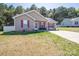 Cute house with red shutters, manicured lawn, and inviting front porch at 2401 Gelsinger Ave, Bessemer City, NC 28016