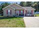 A cozy home with red shutters and a tidy front yard for sale at 2401 Gelsinger Ave, Bessemer City, NC 28016