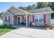 Inviting home with red shutters and a charming front porch sitting area at 2401 Gelsinger Ave, Bessemer City, NC 28016