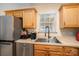 Well-maintained kitchen with stainless steel appliances, cabinetry, and sink at 2401 Gelsinger Ave, Bessemer City, NC 28016