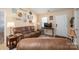 Comfortable living room featuring a plush brown reclining sofa and stylish decor at 2401 Gelsinger Ave, Bessemer City, NC 28016