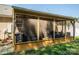 The screened porch has plenty of room for seating and relaxation at 2401 Gelsinger Ave, Bessemer City, NC 28016