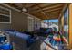 Spacious screened porch featuring ample seating and a ceiling fan, perfect for outdoor living at 2401 Gelsinger Ave, Bessemer City, NC 28016