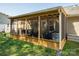 The screened porch is furnished and offers comfortable seating and protection from the elements at 2401 Gelsinger Ave, Bessemer City, NC 28016