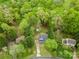 Aerial view of home nestled among lush trees and verdant lawns in a quiet neighborhood at 2717 Stockwood Dr, Gastonia, NC 28056