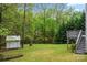 The backyard features a shed and ample lawn space backed by mature trees at 2717 Stockwood Dr, Gastonia, NC 28056