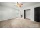 Bright bedroom featuring neutral carpet and open closet at 2717 Stockwood Dr, Gastonia, NC 28056
