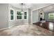 Inviting breakfast nook featuring bright windows and an elegant light fixture at 2717 Stockwood Dr, Gastonia, NC 28056