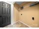 Walk-in closet features shelves and a black door at 2717 Stockwood Dr, Gastonia, NC 28056