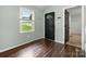 View of the foyer shows the front door and wood floors at 2717 Stockwood Dr, Gastonia, NC 28056