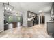 The kitchen features gray cabinetry, stainless steel appliances, and seamless transition to living room at 2717 Stockwood Dr, Gastonia, NC 28056