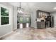 The kitchen features gray cabinetry, stainless steel appliances, and seamless transition to living room at 2717 Stockwood Dr, Gastonia, NC 28056