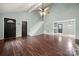 Open living room with hardwood floors, stairs to second floor, and ceiling fan at 2717 Stockwood Dr, Gastonia, NC 28056