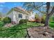 Well-maintained backyard features a deck, mature trees, and lush landscaping at 2740 Cameron Commons Way, Matthews, NC 28104