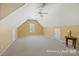 This bonus room has neutral walls and carpet and features attic storage at 2740 Cameron Commons Way, Matthews, NC 28104