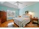 Serene primary bedroom boasts vaulted ceilings, hardwood floors, ample natural light, and a calming color palette at 2740 Cameron Commons Way, Matthews, NC 28104