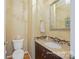 This powder room features a decorative mirror and a granite countertop vanity at 2740 Cameron Commons Way, Matthews, NC 28104