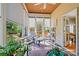 Relax in the sunroom with lots of natural light and views of the beautiful backyard at 2740 Cameron Commons Way, Matthews, NC 28104