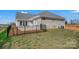 Spacious backyard with a black metal fence and a concrete patio at 3054 Constitution Ln, Gastonia, NC 28056