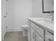 Modern bathroom featuring stylish vanity with a stone countertop and tile flooring at 3054 Constitution Ln, Gastonia, NC 28056