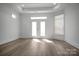 Bright bedroom with hardwood floors, backyard access, and a large window at 3054 Constitution Ln, Gastonia, NC 28056