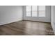 Bright bedroom with beautiful wood-look floors and large windows at 3054 Constitution Ln, Gastonia, NC 28056