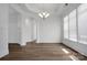 Spacious dining room with hardwood floors and natural light from large windows at 3054 Constitution Ln, Gastonia, NC 28056