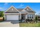 Charming single-Gathering home boasting a two-car garage and well-maintained lawn at 3054 Constitution Ln, Gastonia, NC 28056