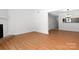 Inviting living area featuring hardwood floors, fireplace, and open concept design with a view to the kitchen at 3709 Willow Point Dr, Charlotte, NC 28277