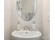 Elegant bathroom with decorative soap dispenser and towels next to a round mirror at 3718 Speer Blvd, Charlotte, NC 28217