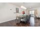 Elegant dining room with modern chandelier, stylish chairs, and hardwood floors at 3718 Speer Blvd, Charlotte, NC 28217