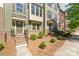 Beautiful townhouse exteriors with front yard landscaping and brick staircases to the front doors at 3718 Speer Blvd, Charlotte, NC 28217