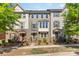 Charming townhomes with a variety of exterior colors and well-maintained landscaping at 3718 Speer Blvd, Charlotte, NC 28217
