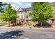 Attractive townhomes with colorful exteriors and street view, lined with mature trees at 3718 Speer Blvd, Charlotte, NC 28217