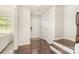 Inviting foyer with hardwood floors, white walls, and a bright window, perfect for guests at 3718 Speer Blvd, Charlotte, NC 28217